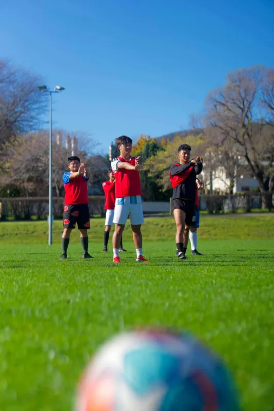 Stretching it out, Himalaya Tasman FC training